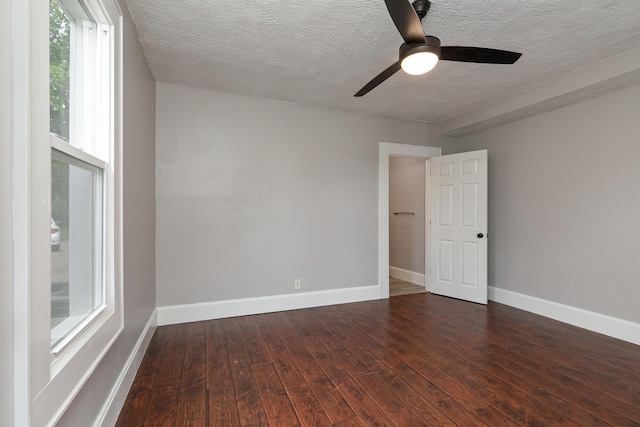 720 W Mount Vernon St, Springfield, MO 65806 - spare room featuring a textured ceiling, wood-type flooring, and a ceiling fan