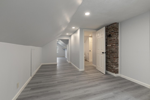 720 W Mount Vernon St, Springfield, MO 65806 - bonus room with wood finished floors, recessed lighting, and vaulted ceiling