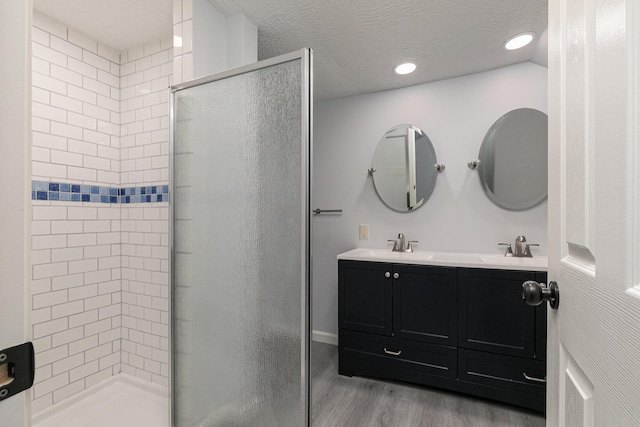 720 W Mount Vernon St, Springfield, MO 65806 - full bath featuring a shower stall, wood finished floors, double vanity, and recessed lighting