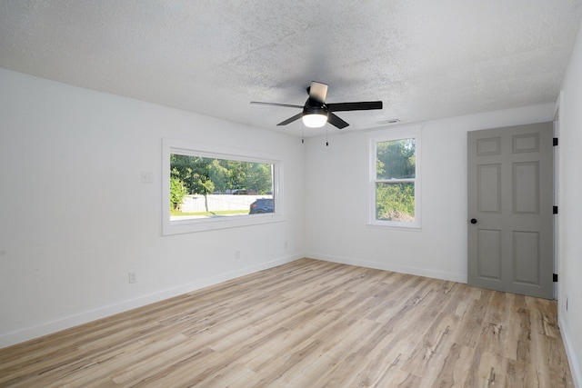 1169 S Miller Ave, Springfield, MO 65802 - spare room with plenty of natural light, light wood-style flooring, a textured ceiling, and ceiling fan