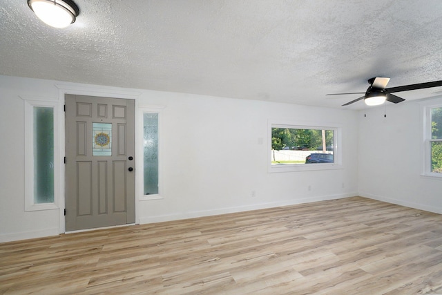 1169 S Miller Ave, Springfield, MO 65802 - entryway with a textured ceiling, light wood-style flooring, a ceiling fan, and healthy amount of natural light