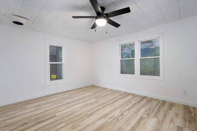1169 S Miller Ave, Springfield, MO 65802 - spare room featuring wood finished floors and a ceiling fan