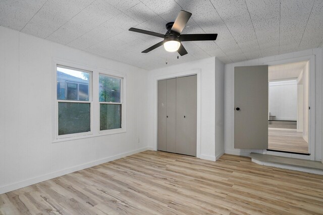 1169 S Miller Ave, Springfield, MO 65802 - unfurnished bedroom featuring light wood-style floors, a closet, and ceiling fan