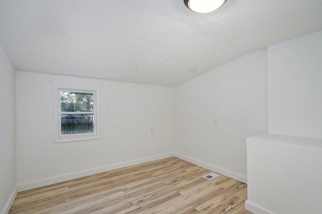 1169 S Miller Ave, Springfield, MO 65802 - additional living space with wood finished floors and vaulted ceiling
