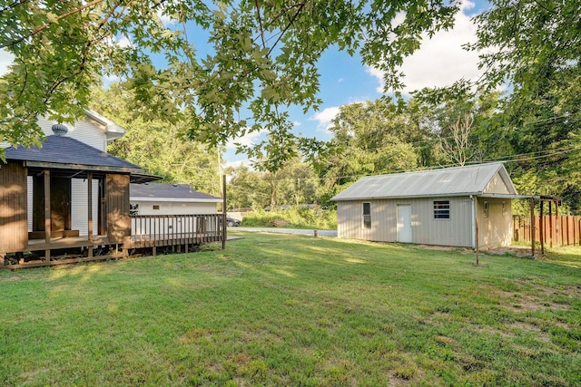 1169 S Miller Ave, Springfield, MO 65802 - view of yard featuring a wooden deck, an outbuilding, and view of scattered trees