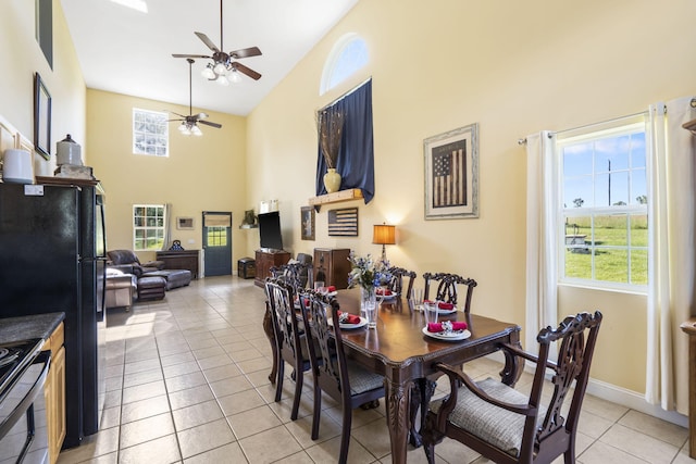 531 Plateau Dr, Marshfield, MO 65706 - dining room with high vaulted ceiling, ceiling fan, healthy amount of natural light, and light tile patterned floors