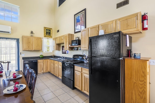531 Plateau Dr, Marshfield, MO 65706 - kitchen with black appliances, a high ceiling, light brown cabinets, a wall mounted air conditioner, and dark countertops