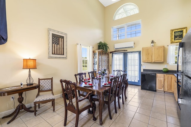 531 Plateau Dr, Marshfield, MO 65706 - dining area featuring a wall mounted air conditioner, light tile patterned flooring, and a towering ceiling