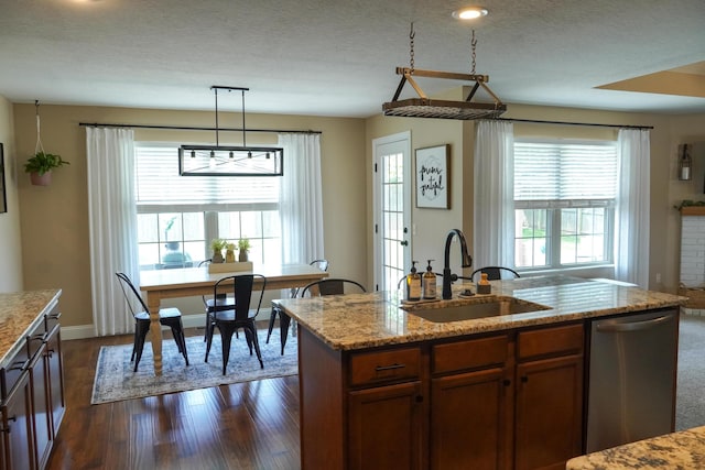 1129 S Erika Ave, Springfield, MO 65802 - kitchen with dishwasher, light stone countertops, dark wood-type flooring, and brown cabinets