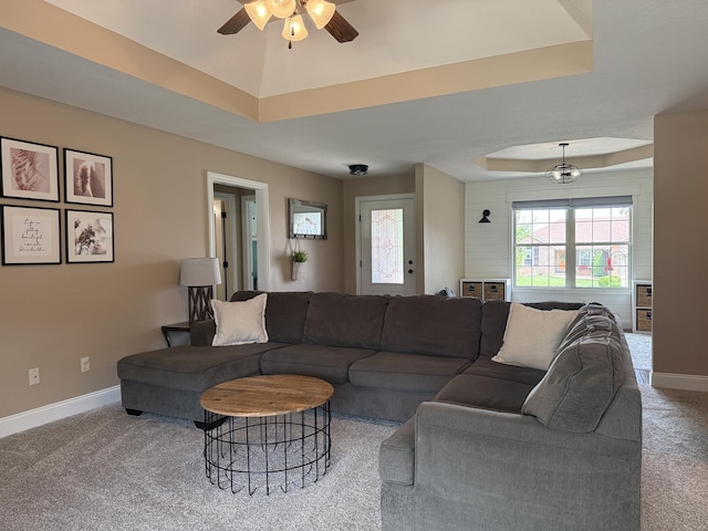 1129 S Erika Ave, Springfield, MO 65802 - living area with a ceiling fan, a tray ceiling, and carpet flooring