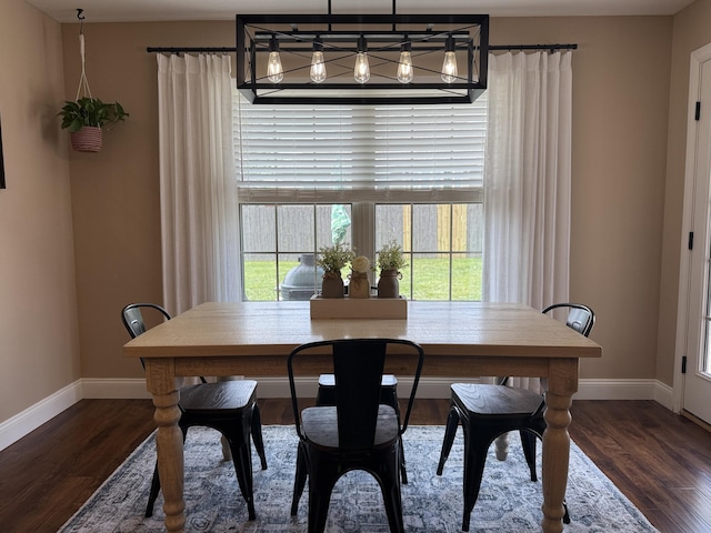 1129 S Erika Ave, Springfield, MO 65802 - dining room featuring wood finished floors and a chandelier