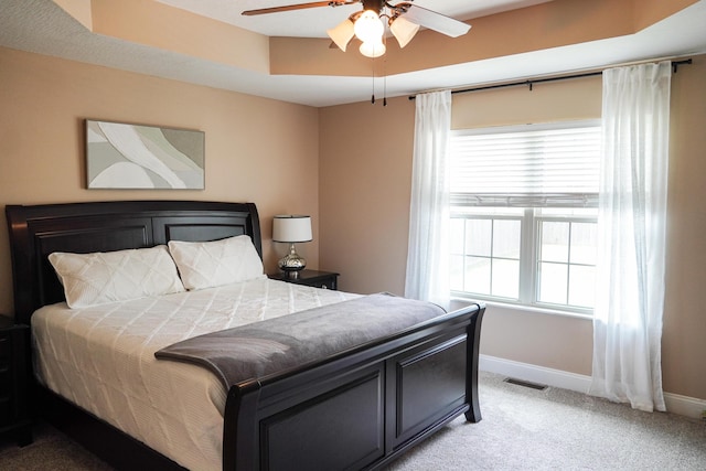 1129 S Erika Ave, Springfield, MO 65802 - bedroom featuring light carpet, multiple windows, and a ceiling fan