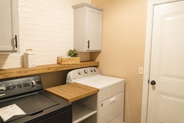 1129 S Erika Ave, Springfield, MO 65802 - washroom with separate washer and dryer and cabinet space
