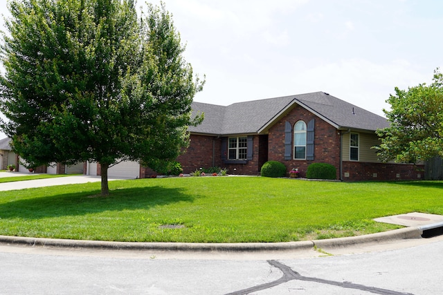 1129 S Erika Ave, Springfield, MO 65802 - ranch-style home with brick siding, a front lawn, driveway, and a garage