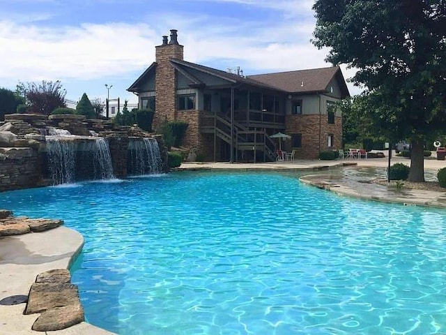 1129 S Erika Ave, Springfield, MO 65802 - swimming pool featuring stairs and a patio area