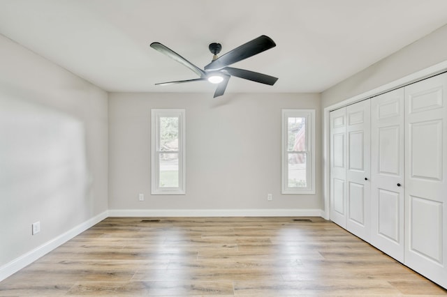 210 N Cedarbrook Ave, Springfield, MO 65802 - unfurnished bedroom featuring light wood-type flooring, a closet, and a ceiling fan