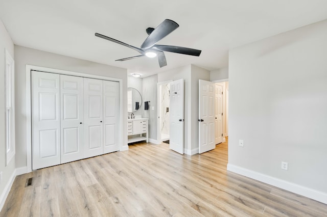 210 N Cedarbrook Ave, Springfield, MO 65802 - unfurnished bedroom with light wood-style flooring, ensuite bathroom, ceiling fan, and a closet