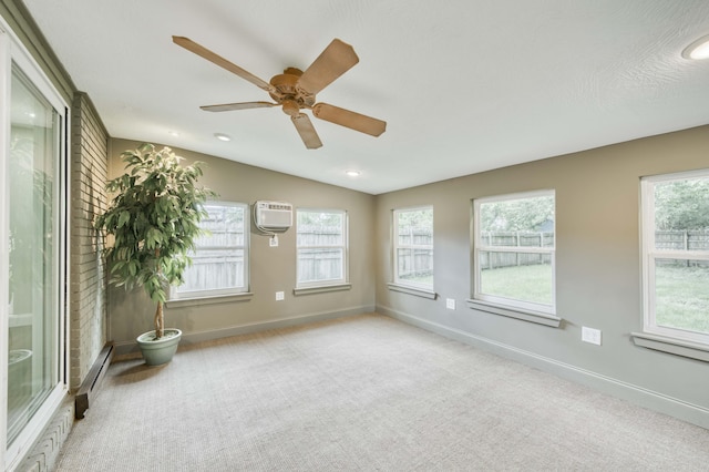210 N Cedarbrook Ave, Springfield, MO 65802 - unfurnished sunroom with a wall mounted air conditioner, vaulted ceiling, and a baseboard radiator
