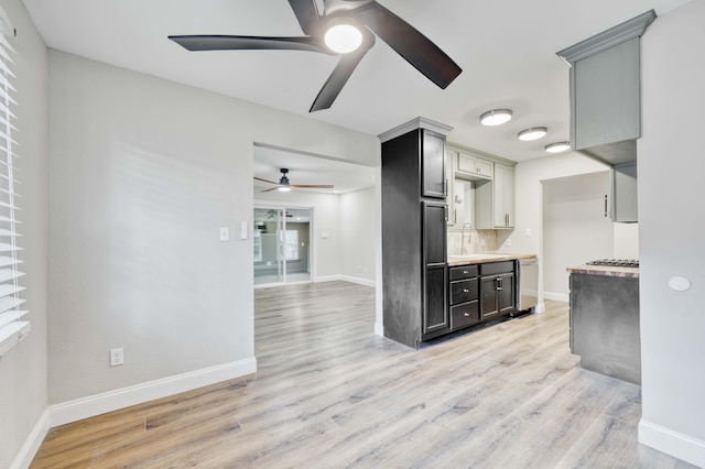 210 N Cedarbrook Ave, Springfield, MO 65802 - kitchen with a ceiling fan, light wood finished floors, light countertops, and tasteful backsplash
