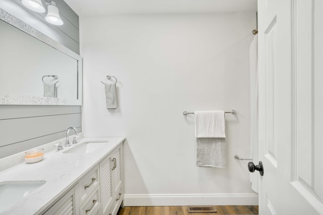 210 N Cedarbrook Ave, Springfield, MO 65802 - bathroom featuring double vanity and wood finished floors