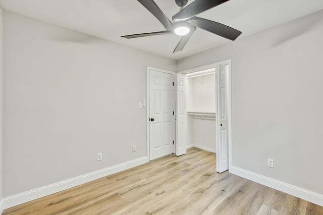 210 N Cedarbrook Ave, Springfield, MO 65802 - unfurnished bedroom with wood finished floors, a ceiling fan, and a closet