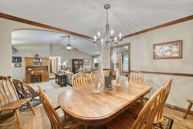 1820 E Jacqueline St, Springfield, MO 65804 - dining room featuring a chandelier, light wood-style floors, vaulted ceiling, arched walkways, and a ceiling fan
