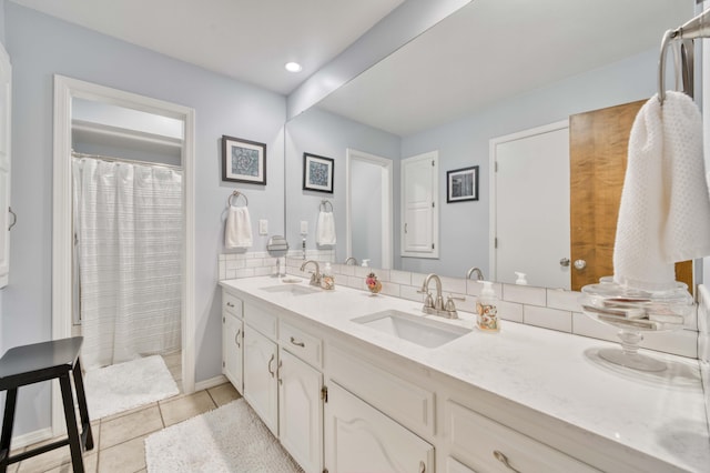 1820 E Jacqueline St, Springfield, MO 65804 - full bathroom with double vanity, tile patterned floors, recessed lighting, and a shower with shower curtain