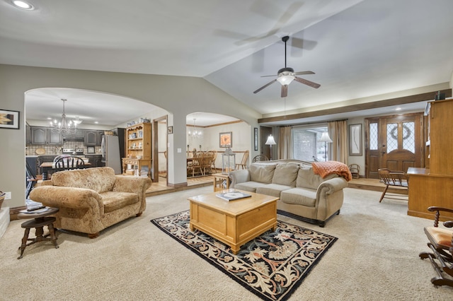 1820 E Jacqueline St, Springfield, MO 65804 - living area with arched walkways, a chandelier, vaulted ceiling, ceiling fan, and light carpet
