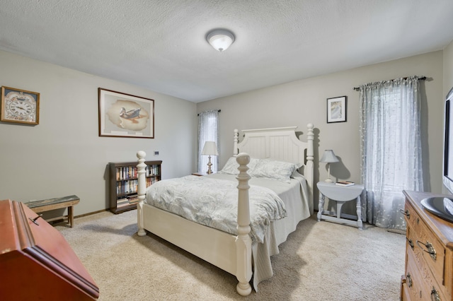 1820 E Jacqueline St, Springfield, MO 65804 - bedroom featuring light colored carpet and a textured ceiling