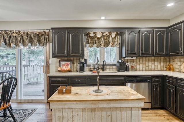 1820 E Jacqueline St, Springfield, MO 65804 - kitchen with stainless steel dishwasher, wooden counters, backsplash, recessed lighting, and light wood-style flooring