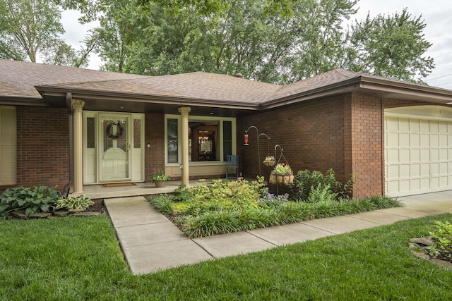 1820 E Jacqueline St, Springfield, MO 65804 - single story home with a garage, brick siding, a porch, and roof with shingles