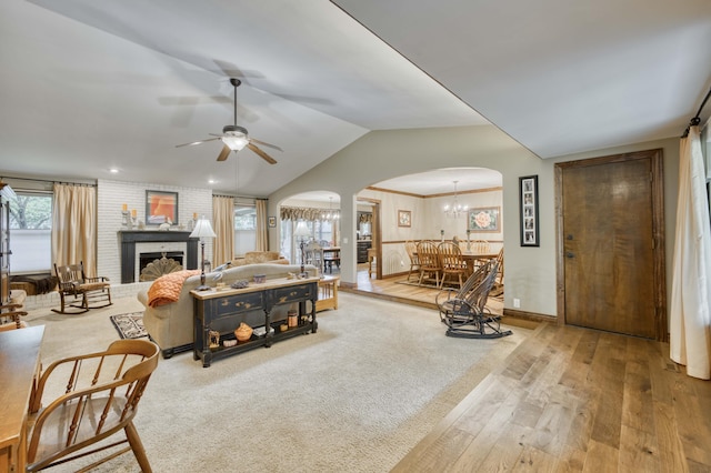 1820 E Jacqueline St, Springfield, MO 65804 - living area featuring arched walkways, hardwood / wood-style flooring, ceiling fan, a chandelier, and lofted ceiling