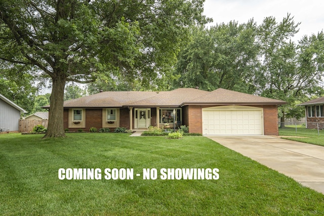 1820 E Jacqueline St, Springfield, MO 65804 - ranch-style home featuring an attached garage, concrete driveway, and brick siding