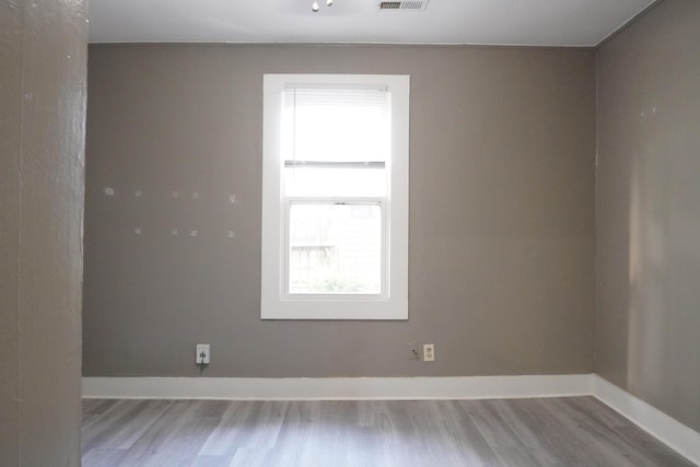 1019 N Clifton Ave, Springfield, MO 65802 - empty room with wood finished floors and baseboards