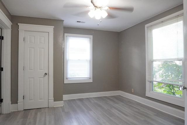 1019 N Clifton Ave, Springfield, MO 65802 - unfurnished room featuring a ceiling fan and light wood-style floors