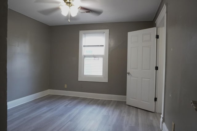 1019 N Clifton Ave, Springfield, MO 65802 - spare room featuring ceiling fan and wood finished floors