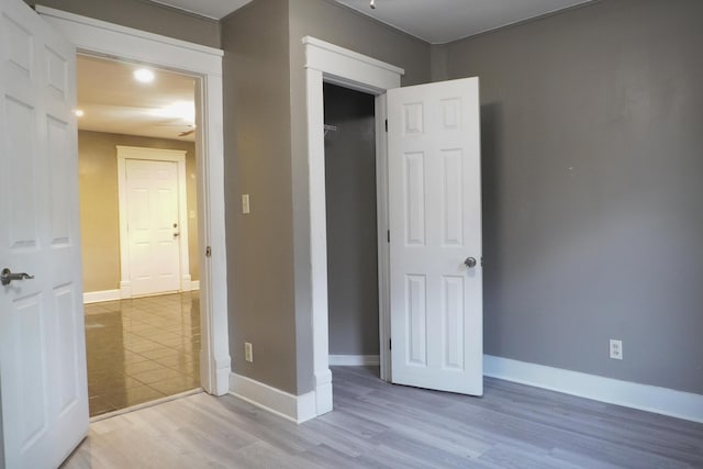 1019 N Clifton Ave, Springfield, MO 65802 - unfurnished bedroom with baseboards and wood finished floors