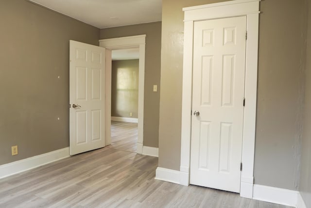 1019 N Clifton Ave, Springfield, MO 65802 - unfurnished bedroom featuring light wood-style floors and a closet