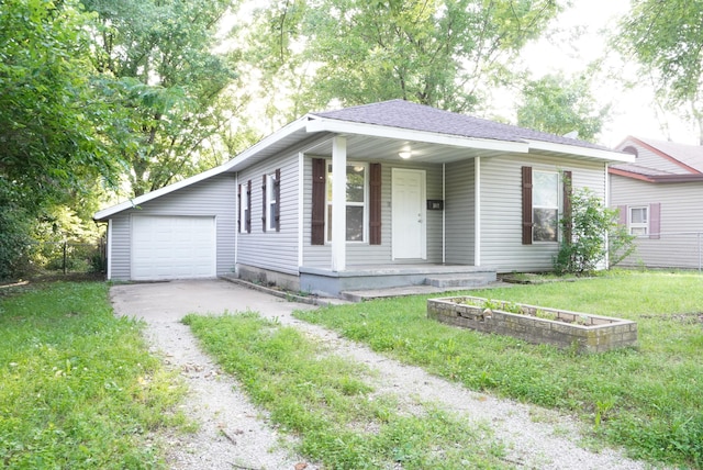 1019 N Clifton Ave, Springfield, MO 65802 - single story home featuring a porch, driveway, a front yard, and a shingled roof