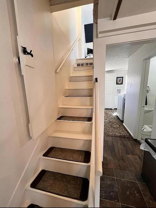 135 Coulter Ln, Forsyth, MO 65653 - staircase with washer / dryer and wood finished floors