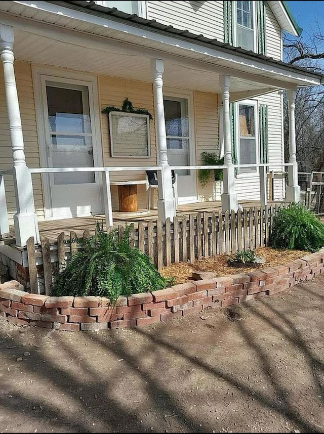 135 Coulter Ln, Forsyth, MO 65653 - view of exterior entry featuring covered porch