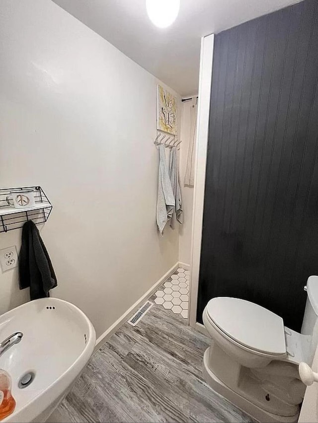 135 Coulter Ln, Forsyth, MO 65653 - bathroom featuring toilet and wood finished floors