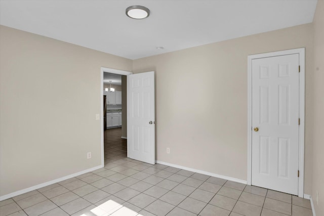 2431 N Kellett Ave, Springfield, MO 65803 - unfurnished room with baseboards and light tile patterned floors