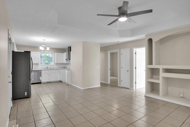 2431 N Kellett Ave, Springfield, MO 65803 - kitchen featuring stainless steel appliances, light tile patterned floors, a ceiling fan, light countertops, and white cabinets