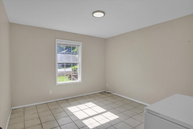 2431 N Kellett Ave, Springfield, MO 65803 - empty room with baseboards and light tile patterned flooring