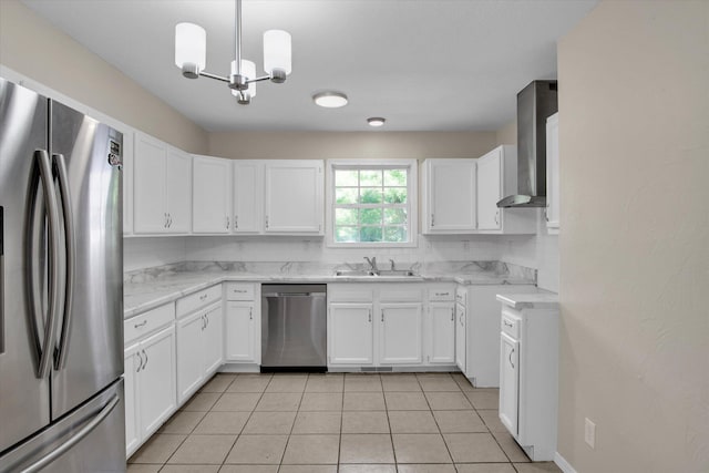 2431 N Kellett Ave, Springfield, MO 65803 - kitchen with appliances with stainless steel finishes, a chandelier, white cabinets, and wall chimney range hood