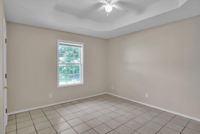 2431 N Kellett Ave, Springfield, MO 65803 - empty room featuring a tray ceiling, ceiling fan, and light tile patterned floors