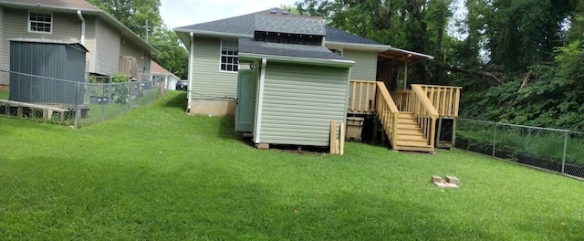 2431 N Kellett Ave, Springfield, MO 65803 - rear view of property with roof with shingles and a deck