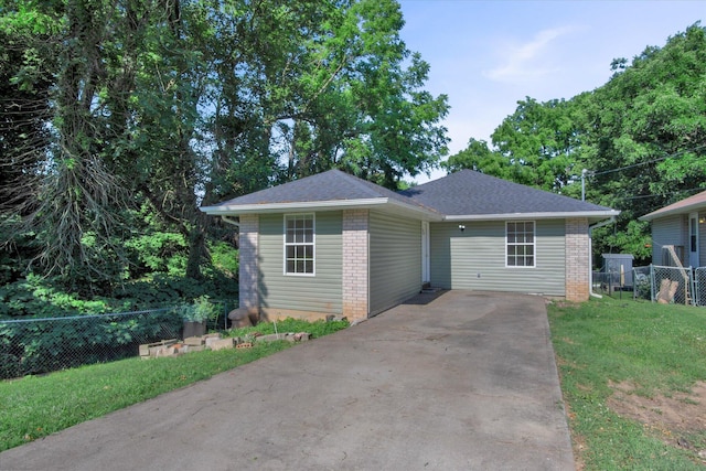 2431 N Kellett Ave, Springfield, MO 65803 - view of front of house featuring concrete driveway and brick siding