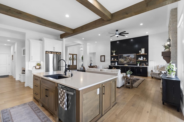 858 E Edenmore Cir, Nixa, MO 65714 - kitchen with appliances with stainless steel finishes, light wood-style flooring, white cabinets, recessed lighting, and beam ceiling